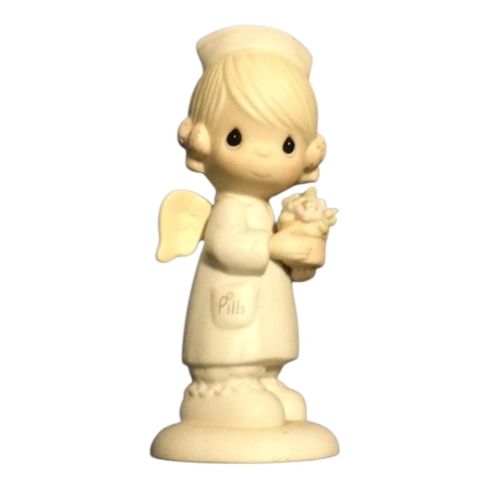 Precious Moments Angel of Mercy 102482 about 5-1/2” high 1986 vintage